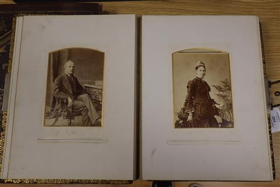 A photograph album and an album of 19th century and later greetings cards and postcards